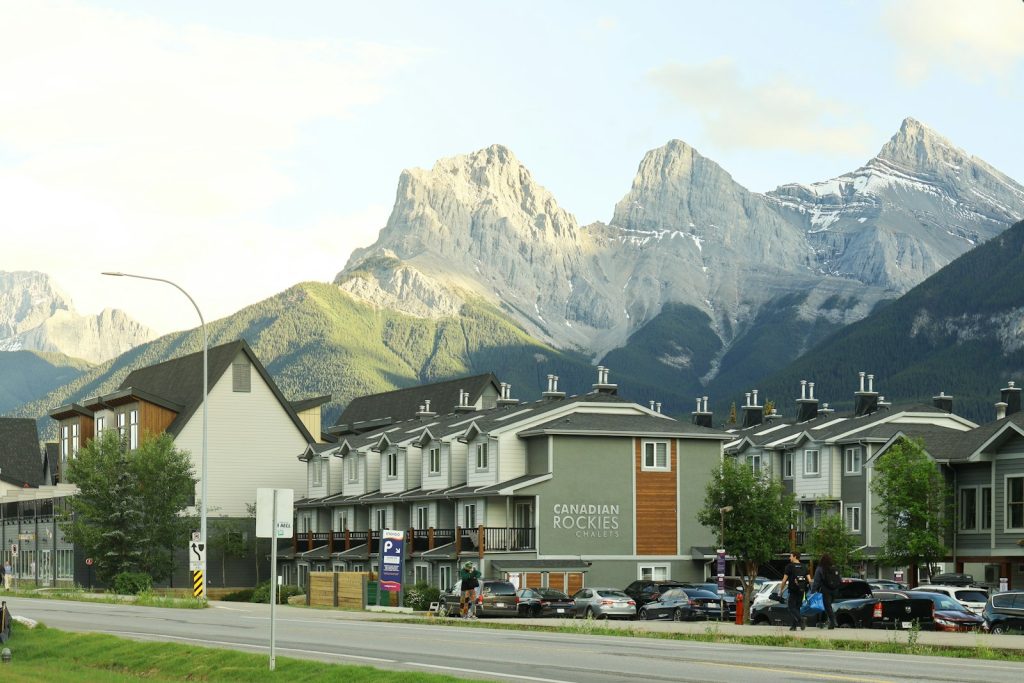 Residential homes in Canmore, Alberta, with the Three Sisters peaks of the Canadian Rockies in the background